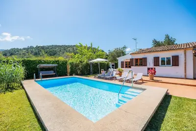 Image de Maison de vacances Can Amer avec vue sur la montagne, Wi-Fi, A/C, piscine, jardin et terrasse