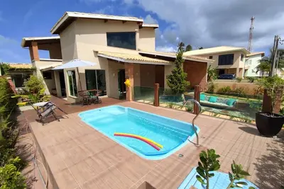 Image de Beautiful furnished 5-suite beach house with swimming pool in gated sea front community.