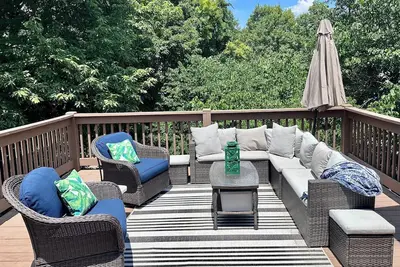 Image de Nestled by the 7th green, large deck areas. Movie theatre for inside or out.
