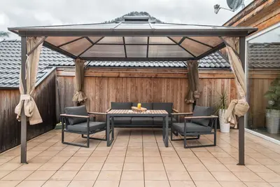 Image de Apattment \"Cater Residence Bun Sté\" avec vue sur montagne, bain à remous, sauna et jardin