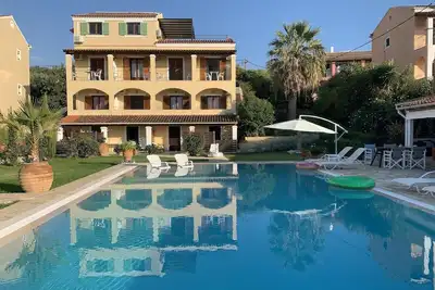 Image de Maison de vacances Acharavi pour 8 - 20 personnes avec 10 chambres à coucher - Maison de vacances