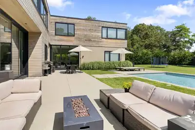 Image de Recently constructed modern-style home with a private pool, open-floor. . .