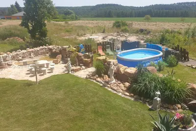 Image de Vacation home \"Palmenland \" with sauna, whirlpool, small waterfall and water place