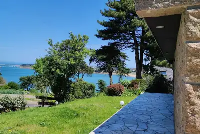 Image de Maison bord de mer, dans un écrin de verdure