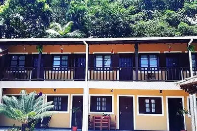 Image de Acolhedora suíte dentro de uma pousada em Paraty