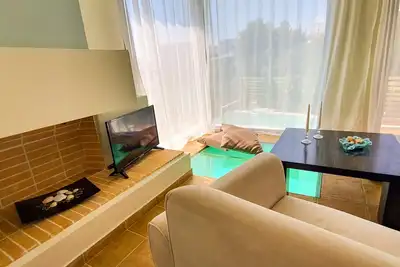 Unique 2 bedroom apartment with garden and pool