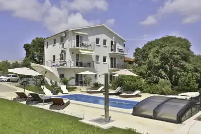Image de Luxusvilla am Meer mit Pool 1