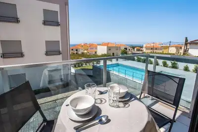 Appartement \"Beach Waves Home\" avec vue sur la mer, piscine et Wi-Fi