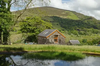 Image de A delightful one-bedroomed holiday cottage located on a farm, nestled into the hills and enjoying sp