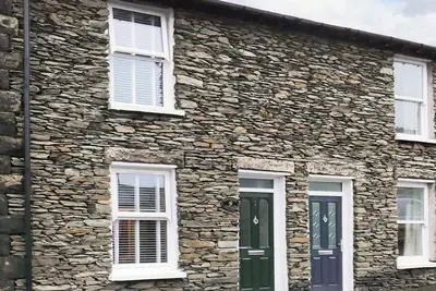 A semi-detached, traditional slate cottage in the heart of Windermere with an enclosed courtyard.