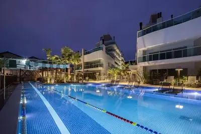 Image de High standard apartment facing Bombas beach with heated outdoor pool