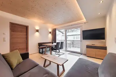 Image de 50m² modern holiday apartment with balcony, free swimming lake, 100 m from the ski area