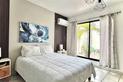 Comfortable modern apartment conveniently located for shopping and dining.