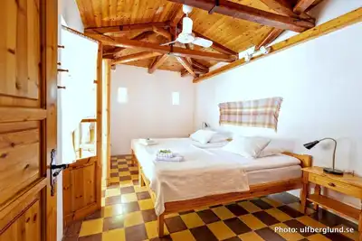 Self catered cottage with large veranda and garden with hammock near the beach.
