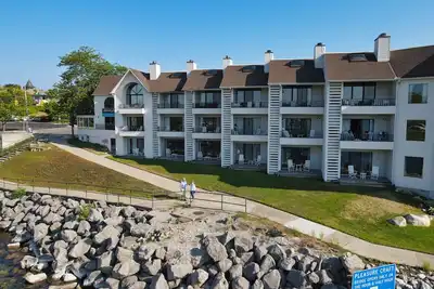 Image de Lake Charlevoix Views with Walkout Patio | Pool, Hot Tub, Sauna | Fireplace