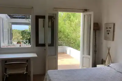 Image de Formentera. Room immersed in the woods with sea view.