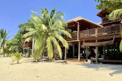 Image de Beachfront home with pristine, calm waters, white sands and unbelievable sunset