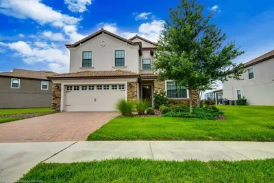 Image de Near Disney Luxury Home 6 Bd with Amazing Pool at Championsgate Resort (1401ww)