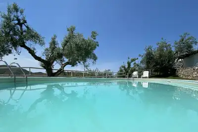 Image de Agriturismo i Giardini di Margius near the sea with swimming pool surrounded by greenery