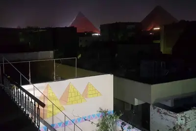 Image de It's a house. it has aquit roof with a view of pyramids