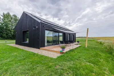 Image de Two country houses with access to their own beach, close to the forest and field