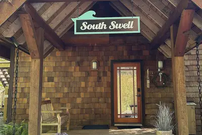 Image de South Swell Tofino (formerly Blue Heron)\nWaterfront home amid old growth cedars