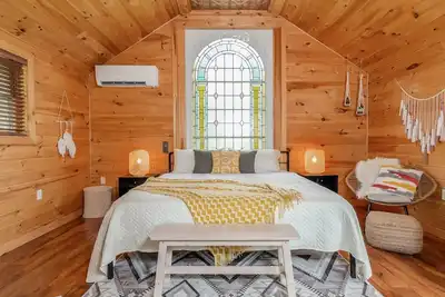 Boho room with King bed at New Park, a picturesque Finger Lakes event venue