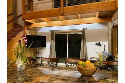 Image de Custom cottage feels bright & airy yet cozy and private in this country setting.