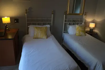 Aloha Lodge spacious bedroom, sleeps 2, with its own entrance and  a garden view
