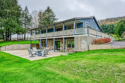 Image de Dog-friendly home with private pond, wraparound porch & fireplaces