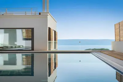Image de Villa Senzea - villa moderne avec piscine chauffée, salle de sport, sauna, jacuzzi et vue sur mer par MyWaycation