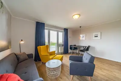 Image de Family-friendly vacation apartment close to the beach with balcony and North Sea view - Hus