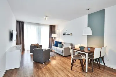 Image de Beachfront, chic apartment with terrace incl. use of swimming pool & sauna -