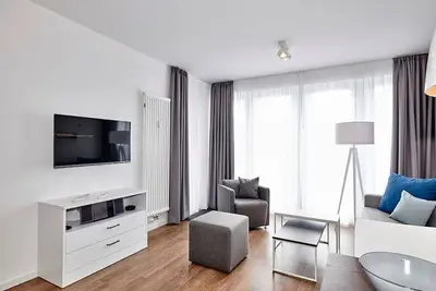 Image de Great apartment near the North Sea with south-facing terrace incl. use of swimming pool & sauna -