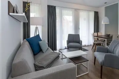 Image de North Sea apartment with terrace incl. parking, use of swimming pool & sauna -