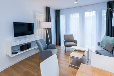 Image de Beachfront apartment with terrace incl. parking, use of swimming pool & sauna -