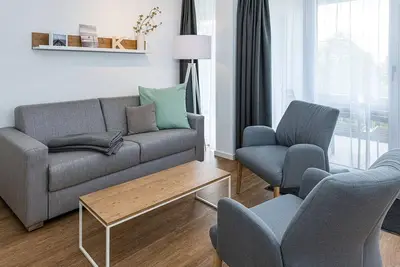 Image de Beachfront apartment with large balcony, parking, use of swimming pool & sauna -