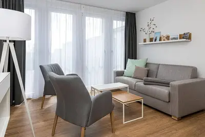 Image de North Sea apartment with balcony, parking, use of swimming pool & sauna, close to the beach!