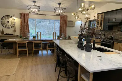 Image de Lakewood Farmhouse with exceptional kitchen/ great room.