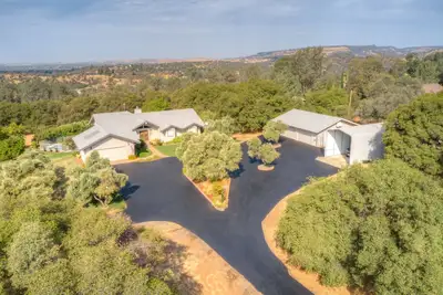 Image de Spacious residential home with pool, bar, and game room.