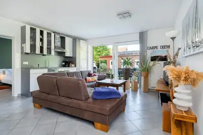 Image de Pura Vida - Ferienwohnung mit GroĂźem Garten in Norddeich