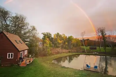 Home with a spring-fed pond and mountain view.