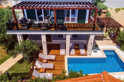 Image de Maison de vacances pour 8 personnes env. 105 qmà Stanići, Dalmatie (Centre de la Dalmatie)