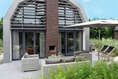 Luxurious holiday home with sauna in a dune reserve, 2 km from the sea