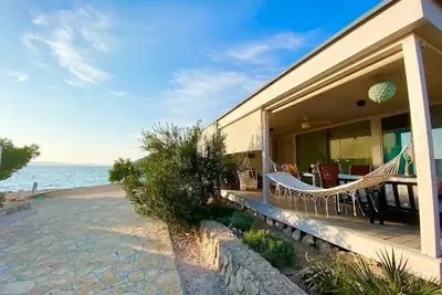 Image de Camp Buqez Villa #30 with whirlpool, directly on the beach, dogs welcome