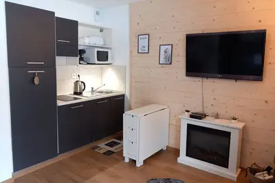 Image de Jolie studio aux pieds des pistes avec piscine chauffée.