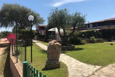 Image de Maison de vacances 'San Teodoro A' avec Wi-Fi, climatisation et terrasse