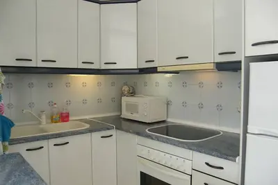 Pleasant apartment in private residence with community pool.