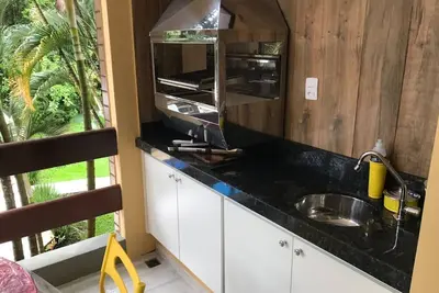 Image de Riviera de São Lourenço apartment with gourmet balcony, smart Tv and Wi-Fi