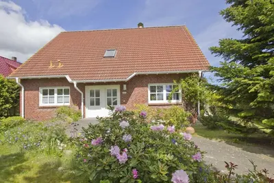 Image de Vacation apartment close to the beach with a beautiful garden - Ferienhaus Gisela - Holiday home